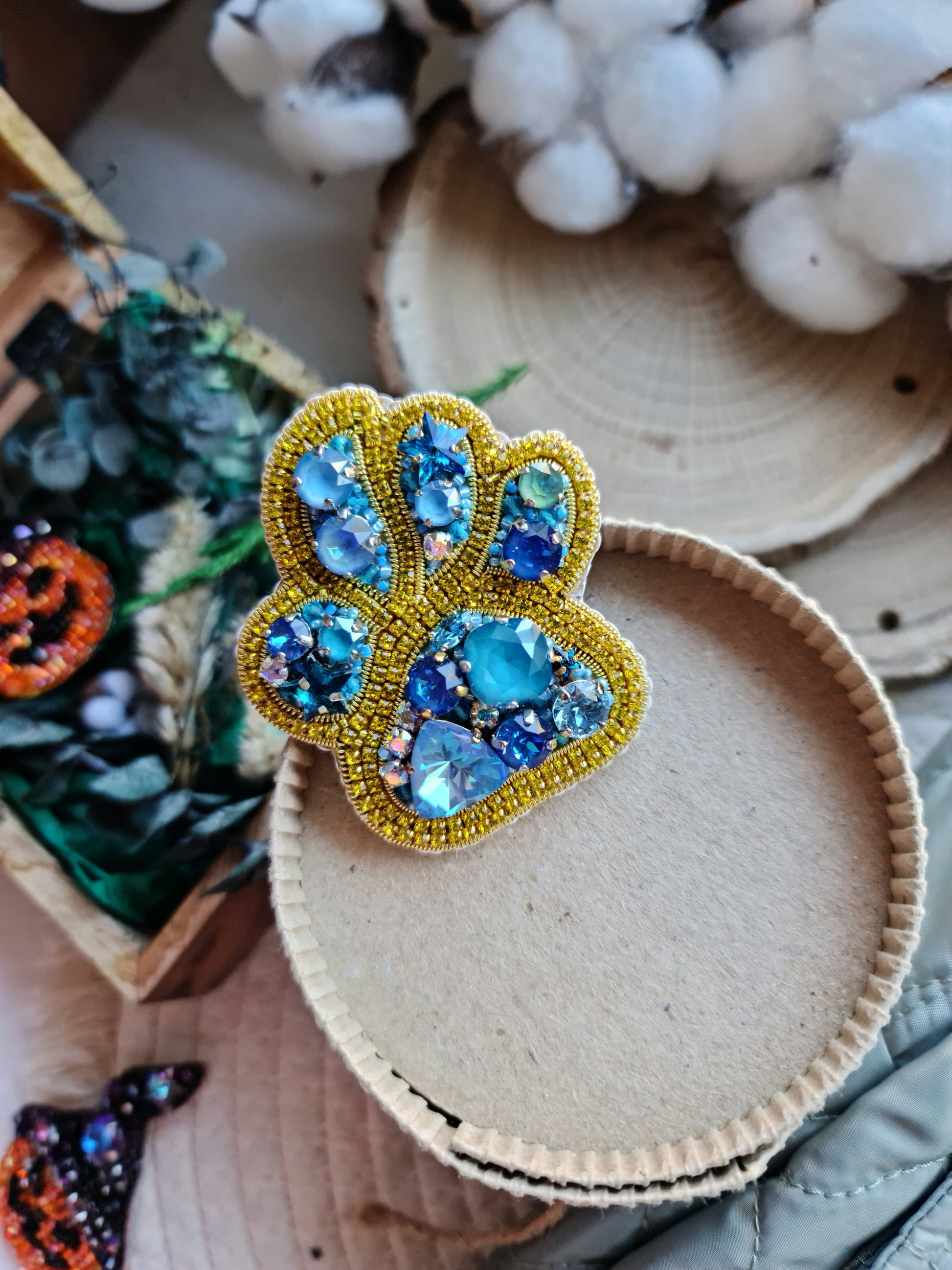 Pet paw beaded brooch hand embroidered with gold beads blue crystals and sparkling rhinestone details