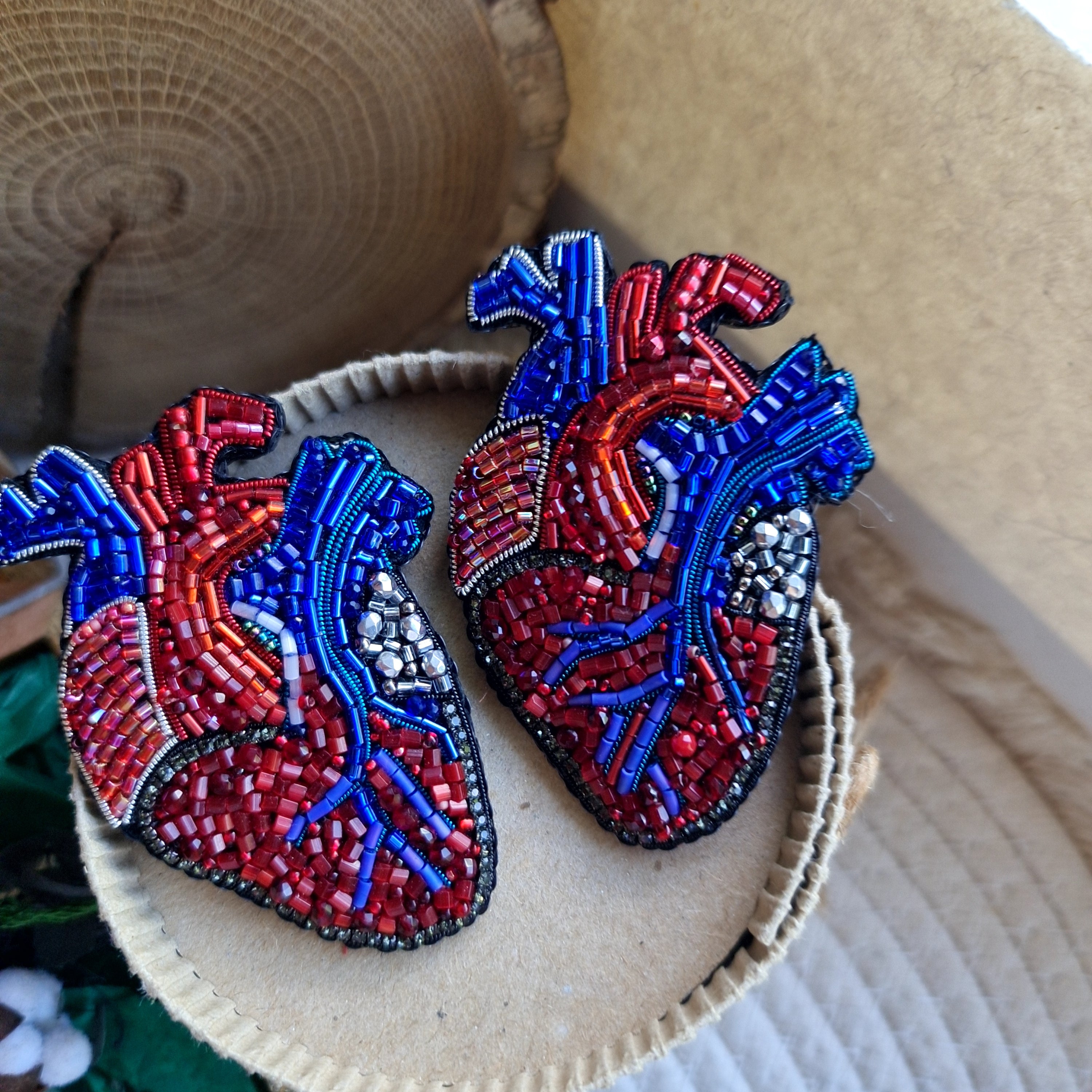 Anatomical heart beaded brooch hand embroidered with red and blue bead details