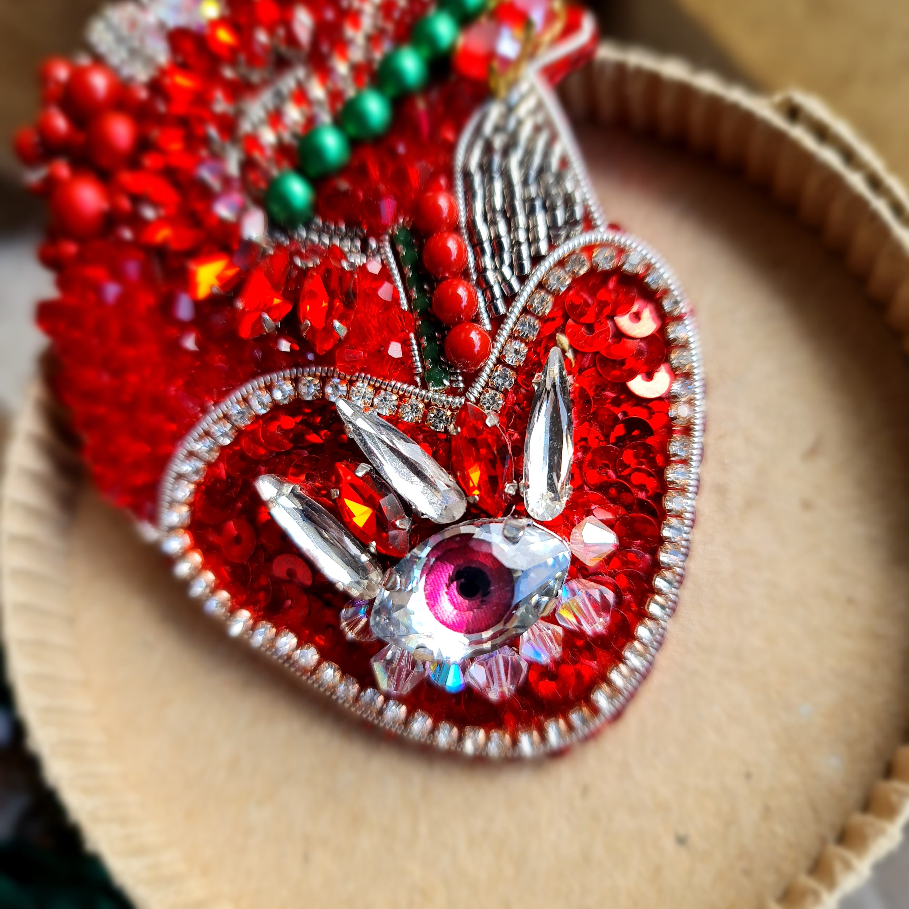 Red anatomical heart brooch with pink eye, hand embroidered with beads and crystals
