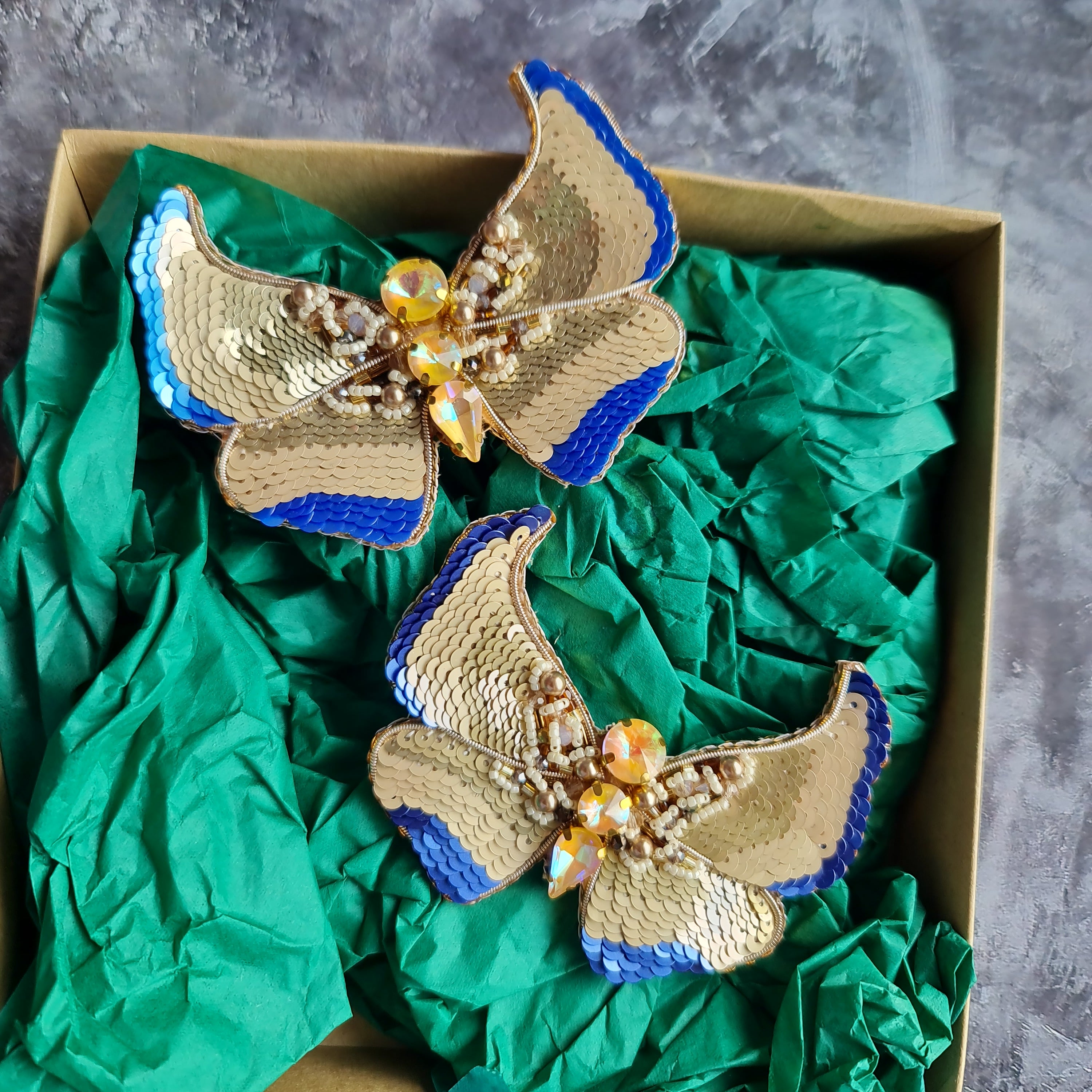 Gold butterfly beaded brooch hand embroidered with cream sequins blue accents crystals and pearl details
