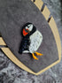 Handmade puffin beaded brooch embroidered with black, white, and orange sequins, beads, and crystals