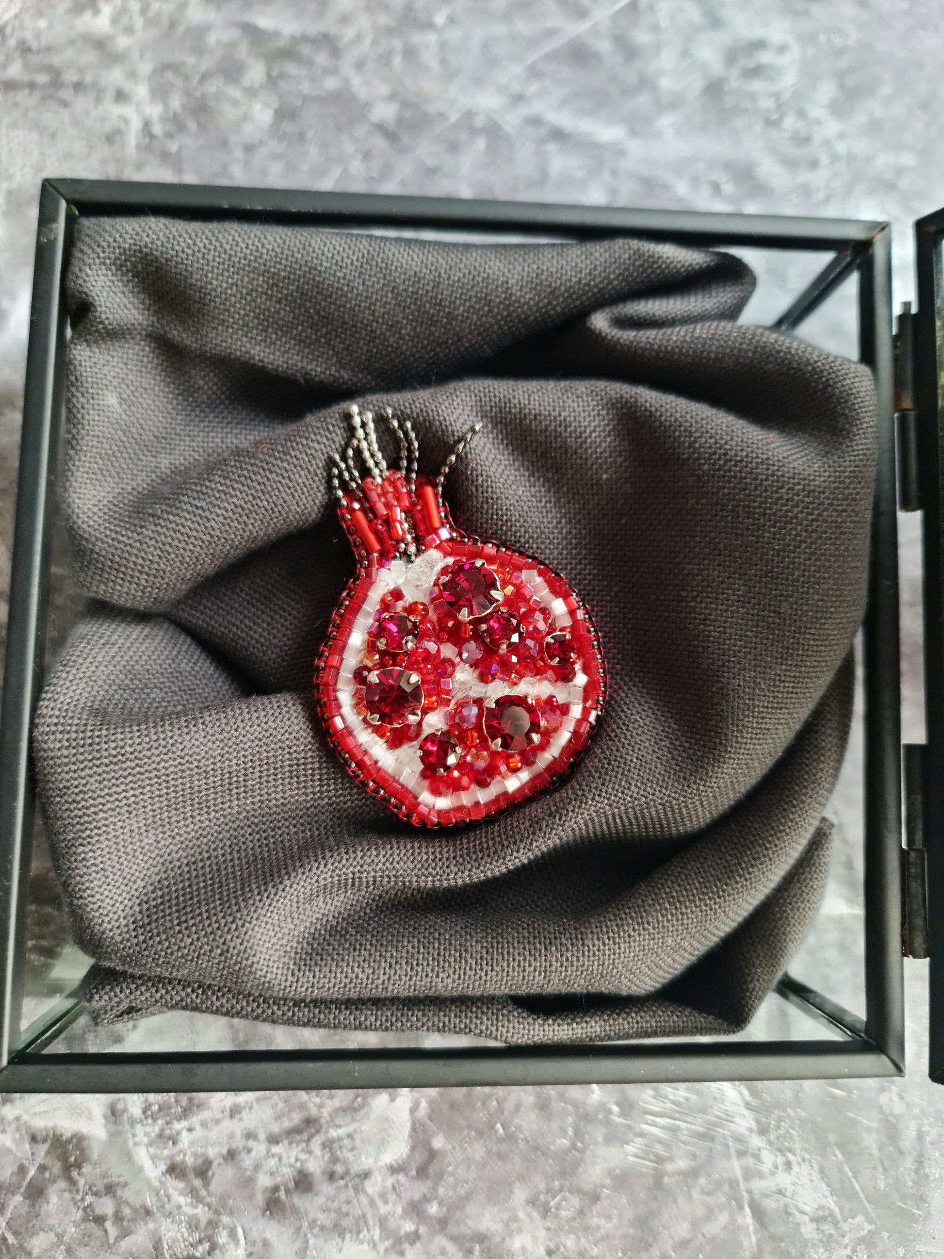 Red pomegranate beaded brooch hand embroidered with red crystals, white beads, pearls, and sparkling fruit details, available in small and large sizes