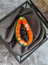 Papaya beaded brooch hand embroidered with orange beads black seed details green edge and sparkling crystals