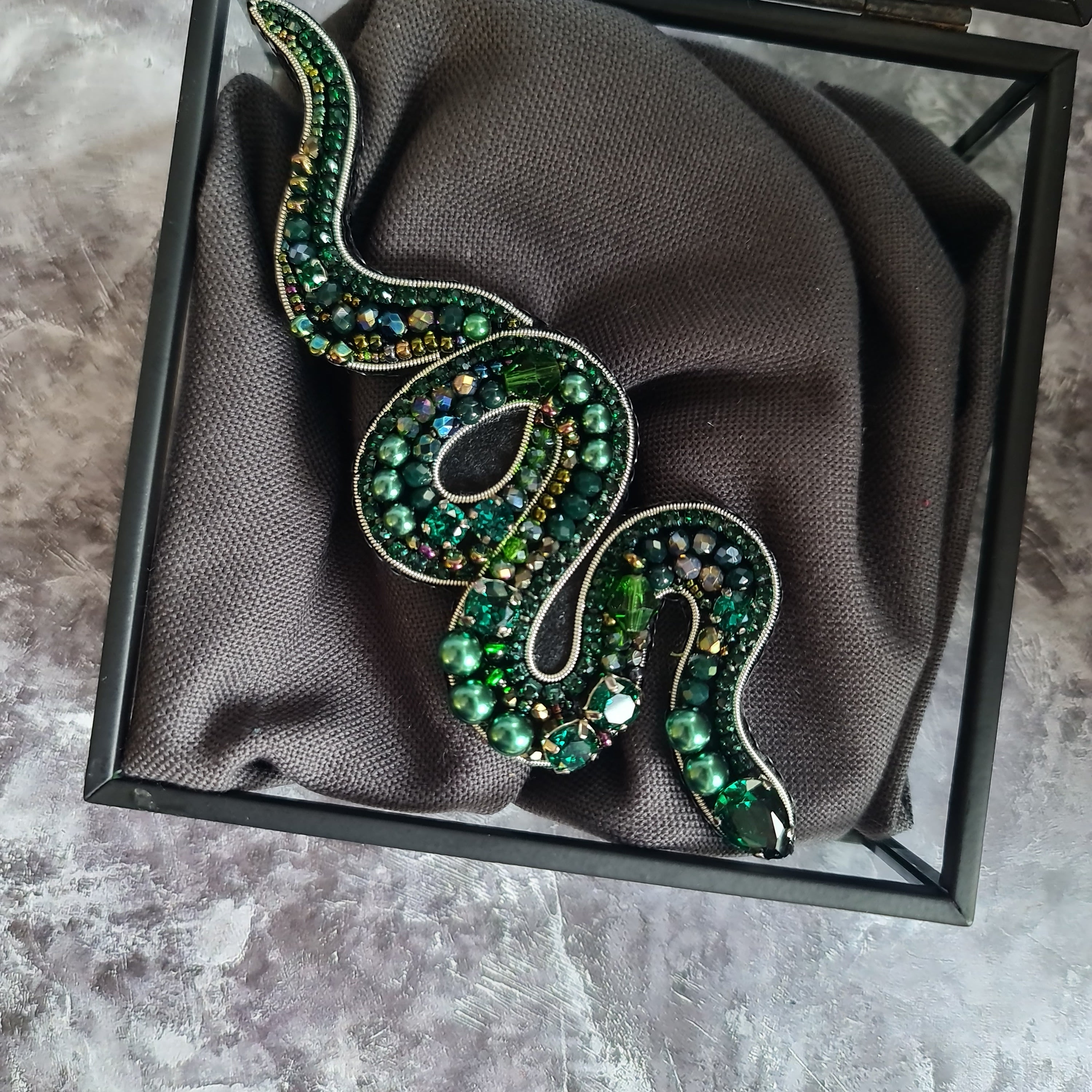 Hand embroidered snake brooch available in gold and emerald with crystals beads and rhinestone details