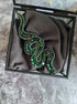 Hand embroidered snake brooch available in gold and emerald with crystals beads and rhinestone details