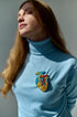 Model wearing the Anatomical Heart Embroidered Brooch pinned on a jacket, highlighting its artistic design and craftsmanship