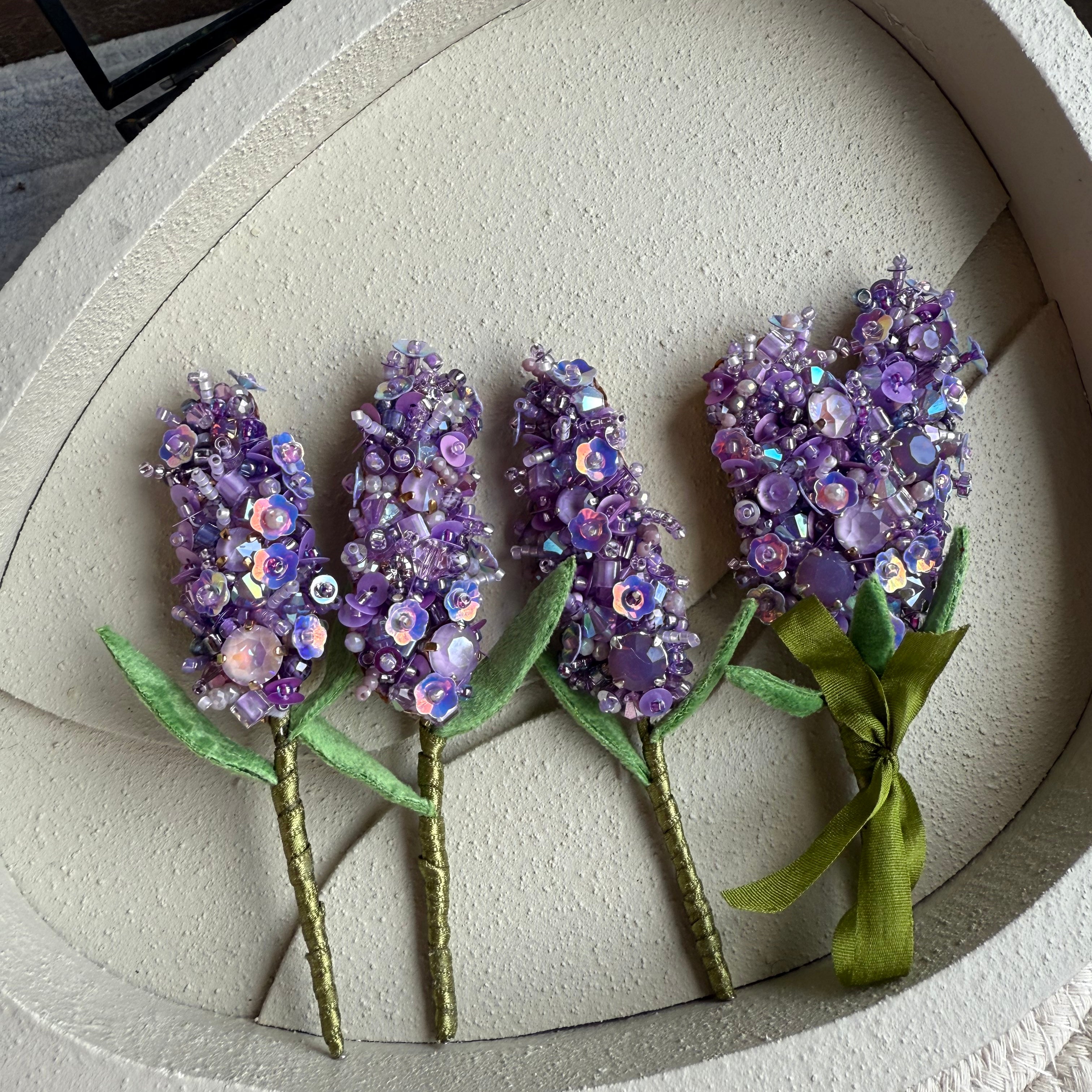Purple lavender beaded brooch hand embroidered with crystals, sequins, and beads, available as a single stem or triple lavender bouquet