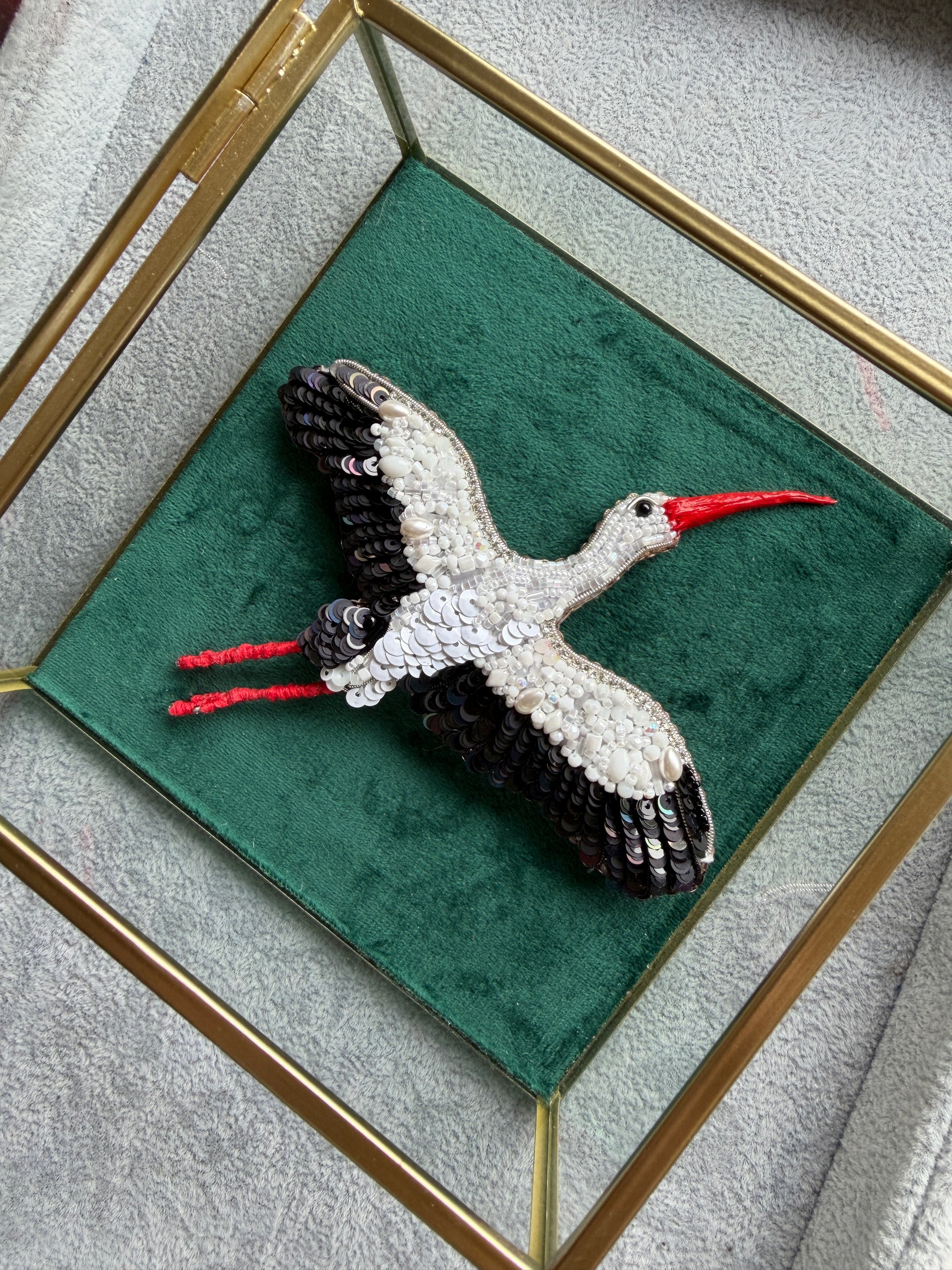 White stork beaded brooch hand embroidered with black wings and red beak
