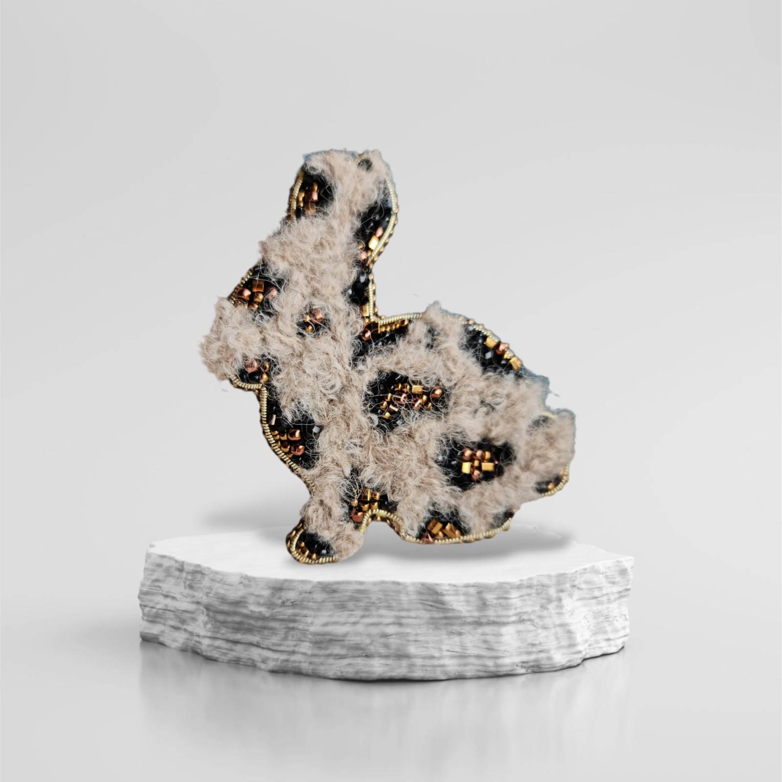 Spotted bunny beaded brooch hand embroidered with fluffy texture black spots and gold details