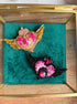 Two handmade Sailor Moon inspired heart brooches in black and pink and gold and pink color options, decorated with sparkling crystals.