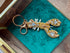 Handmade gold lobster keychain decorated with sparkling crystals and pearl beads, a unique ocean-inspired handbag and key accessory.