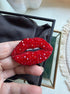 Handmade red lips beaded brooch with sparkling red crystals, closed lips design, statement jewelry accessory.
