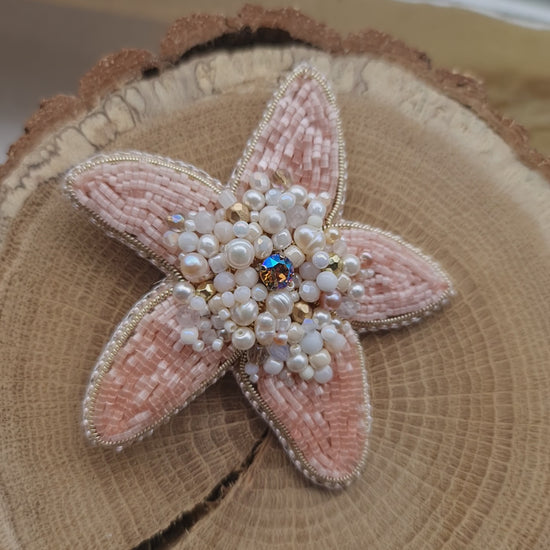 Close-up of the Stellar Seas Starfish Brooch showcasing detailed beadwork and embroidery with delicate Japanese beads, crystals, and pearls on a starfish design.