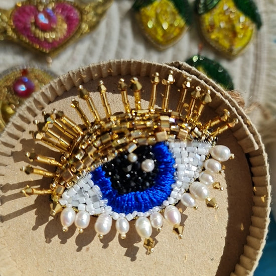 Close-up view of the intricate eye motif on the Enchanting Gaze Eye Brooch, showcasing detailed craftsmanship and unique design elements