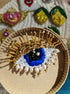Close-up view of the intricate eye motif on the Enchanting Gaze Eye Brooch, showcasing detailed craftsmanship and unique design elements