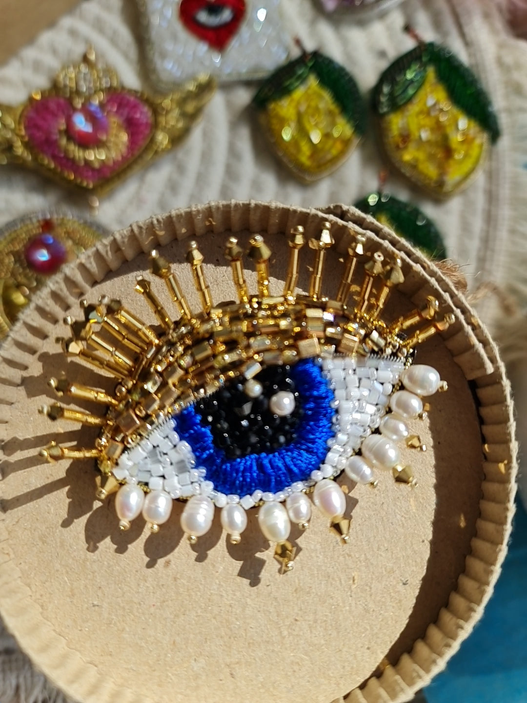 Close-up view of the intricate eye motif on the Enchanting Gaze Eye Brooch, showcasing detailed craftsmanship and unique design elements